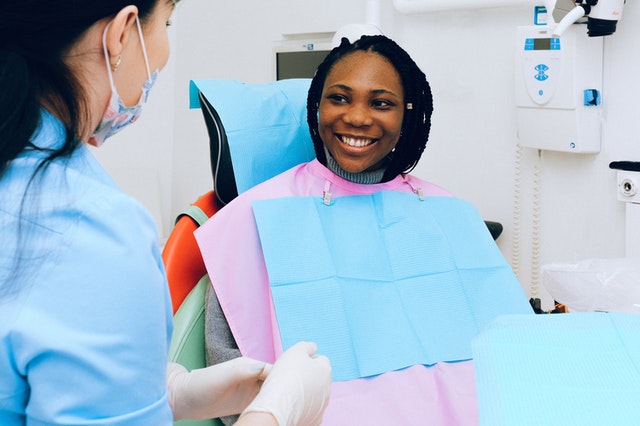 Woman smiling at dentist office