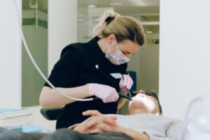 Dentist doing a dental cleaning